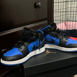 Nike Air Jordan 1 Black and Blue Sneakers with Iconic Design